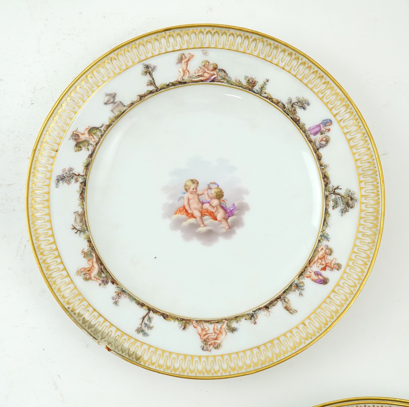 A set of six Meissen plates, decorated in the Capodimonte style, late 19th century